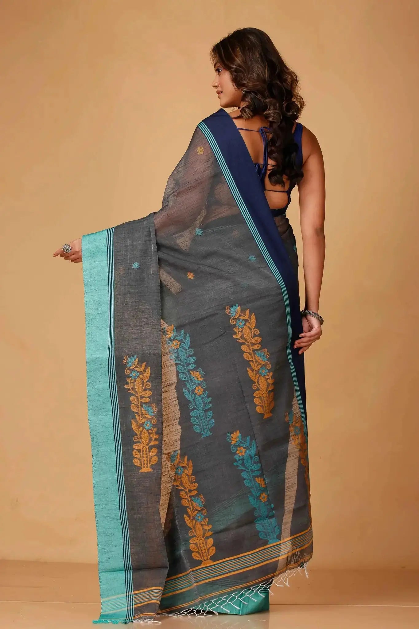Elegant Black & Green Manipuri Cotton Saree With Blue & Mustard Woven Border