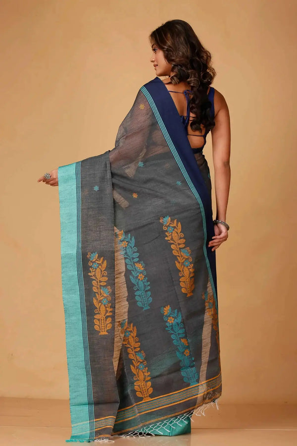 Elegant Black & Green Manipuri Cotton Saree With Blue & Mustard Woven Border