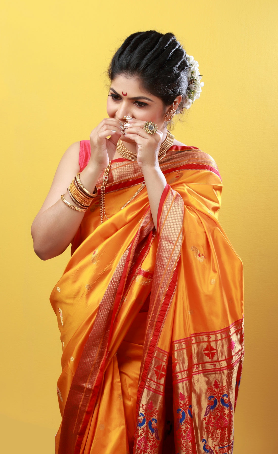 woman in orange and yellow sari