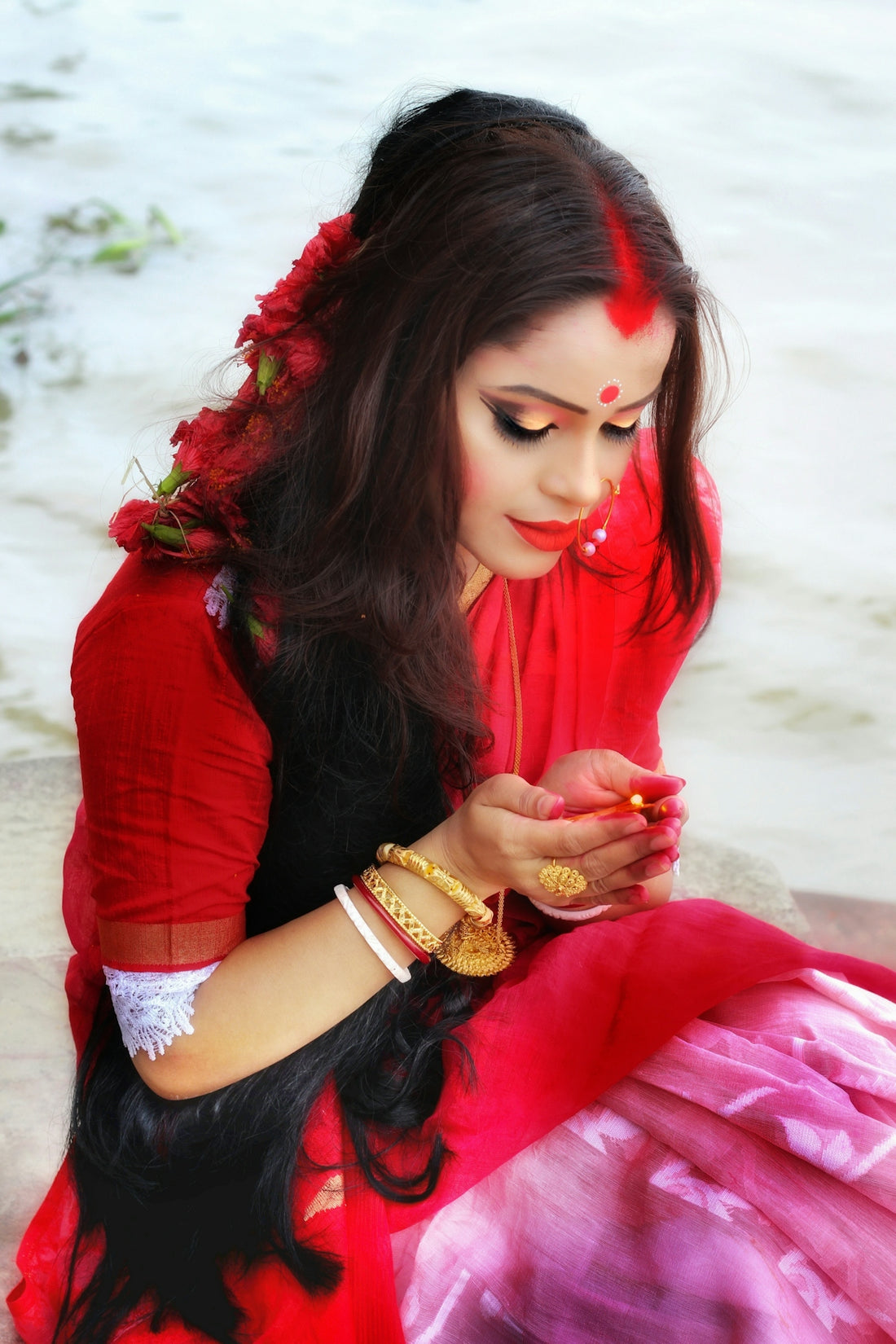 woman in red long sleeve shirt and black leather strap watch