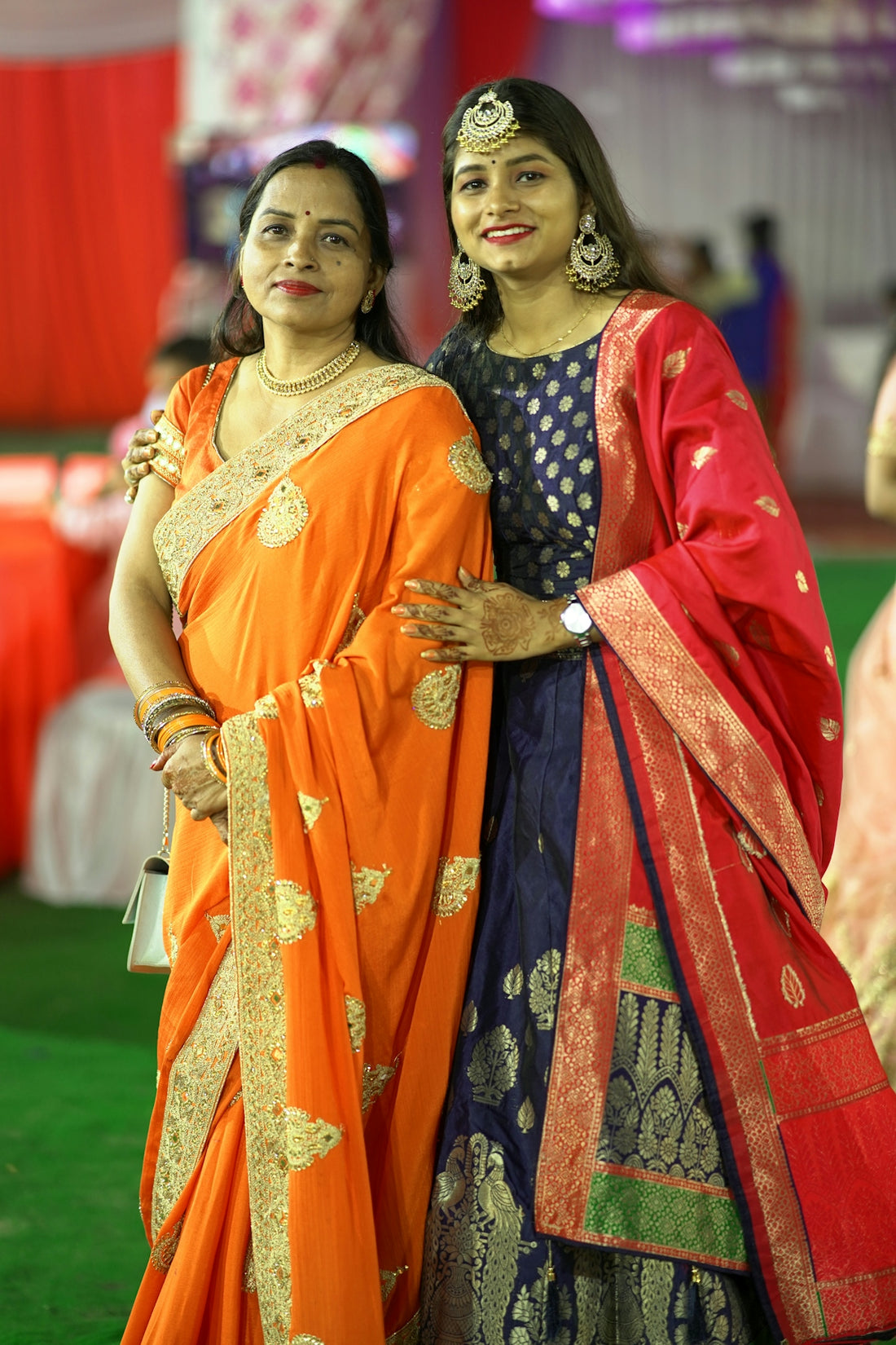 a couple of women standing next to each other