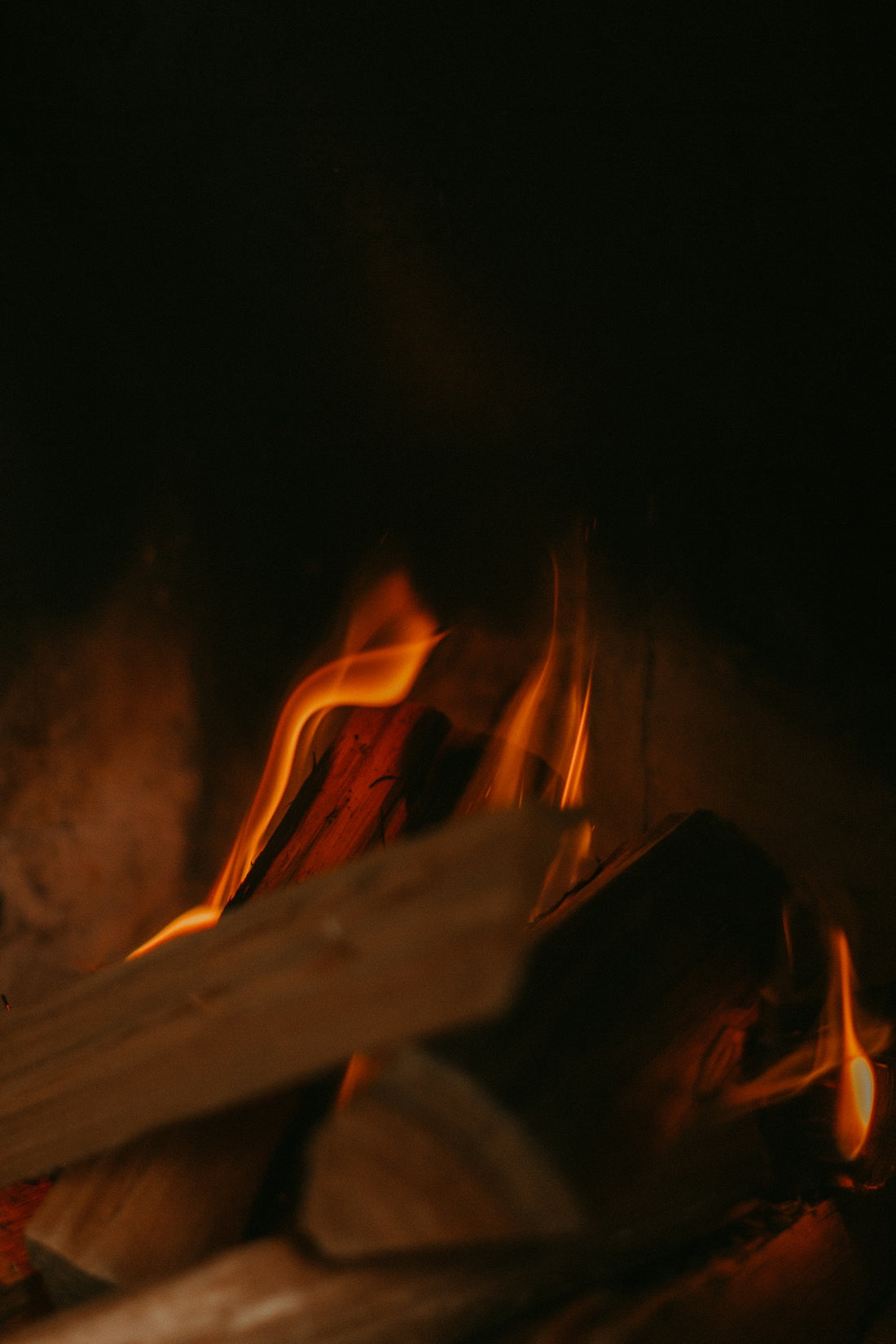 a close up of a fire burning in a fireplace