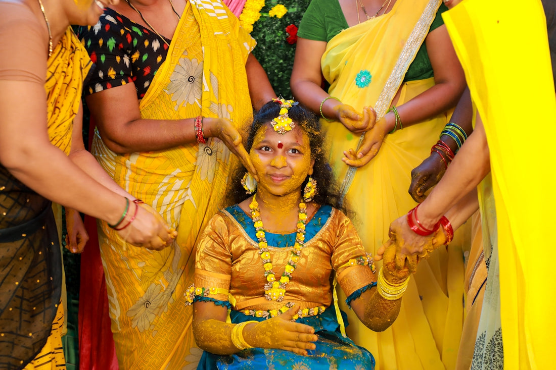 A group of women dressed in brightly colored clothing