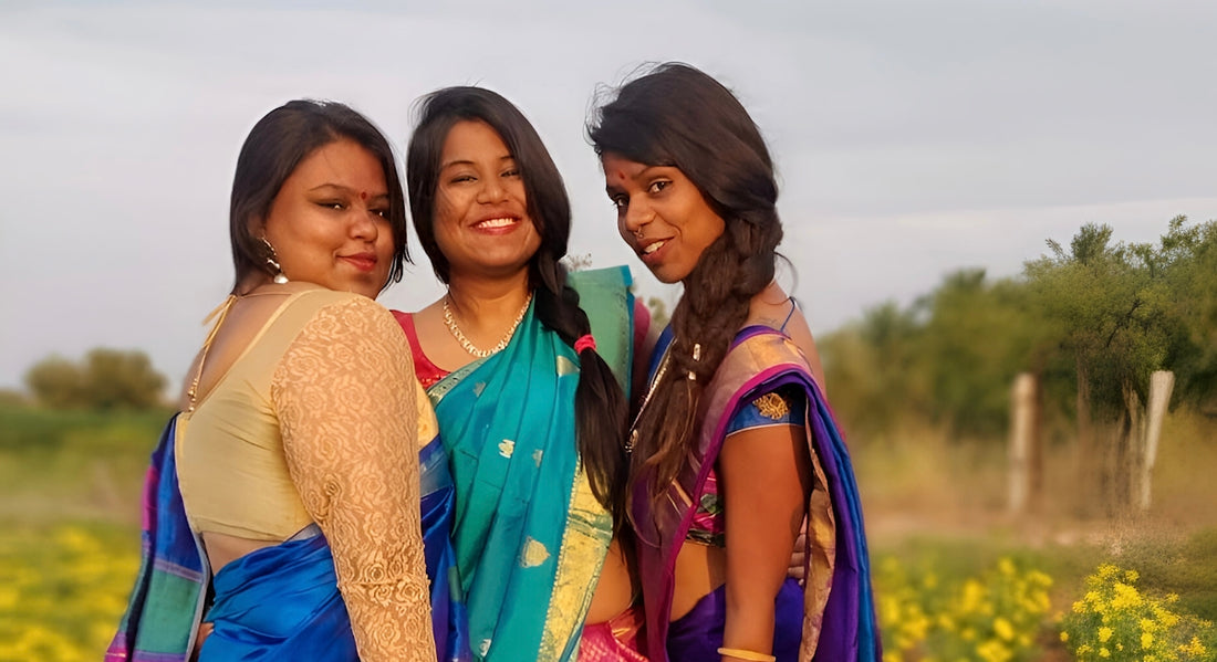 A group of three women standing next to each other