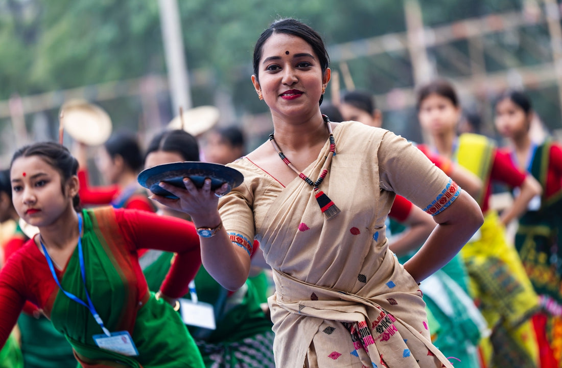Women are dressed in traditional attire, dancing.